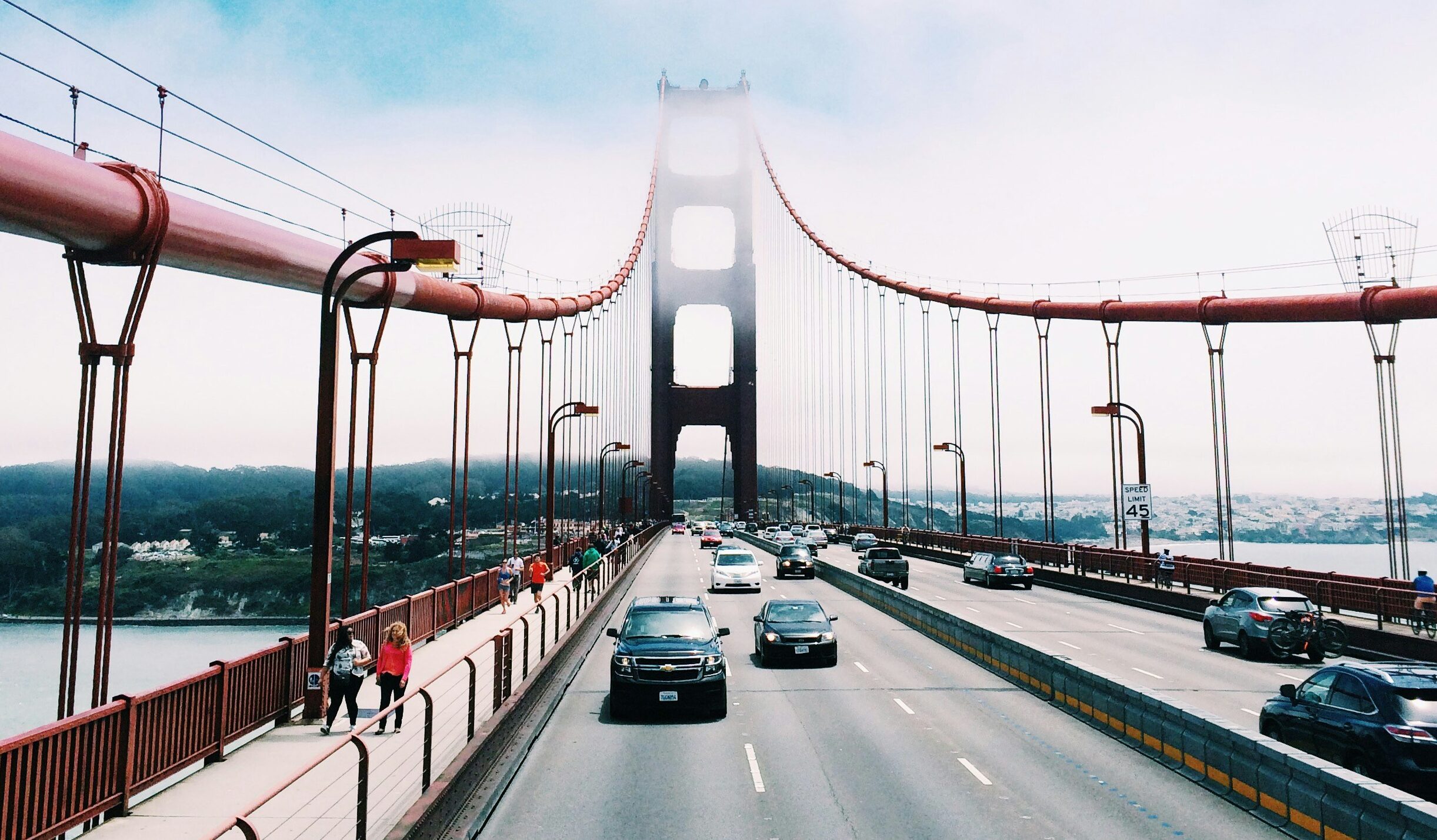 Cars travelling across US bridge